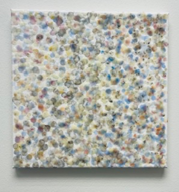 A square abstract painting speckled with pastel blue, yellow, and pink dots on a white ground.