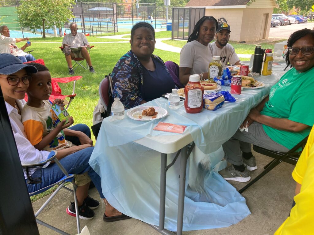 An image of CLB staff enjoying lunch after facilitating eye care screenings at St. John's Baptist Church.
